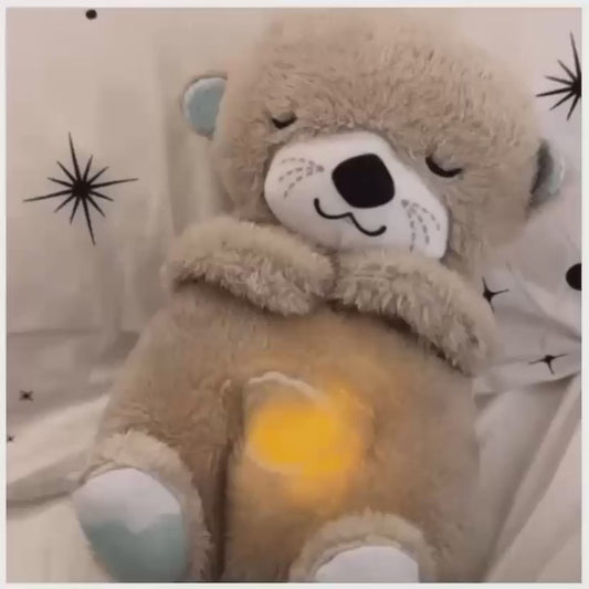Peluche Nutria que respira, material suave, sonidos y luz relajante.